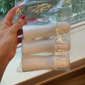 Refillable roller ball containers